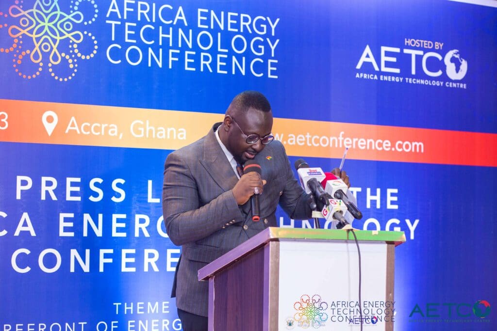 A speaker in glasses at the lectern at the press launch of the first Africa Energy Technology Conference, Alisa Hotel, Accra, June 2023