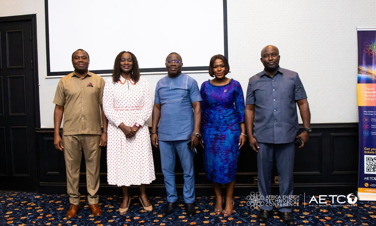 Guests stand together in front of a projection screen at the Centre's breakfast meeting for AETC 2025, Labadi Beach Hotel, Accra, November 2024