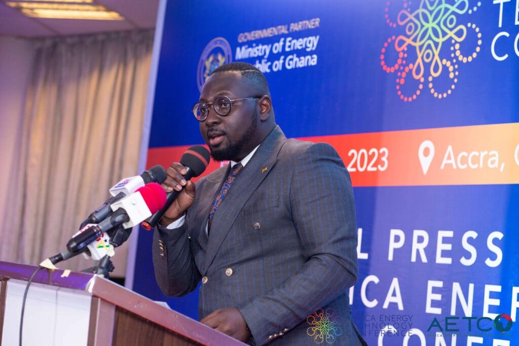 A speaker in a dark suit speaks at the lectern at the press launch of the first Africa Energy Technology Conference, Alisa Hotel, Accra, June 2023