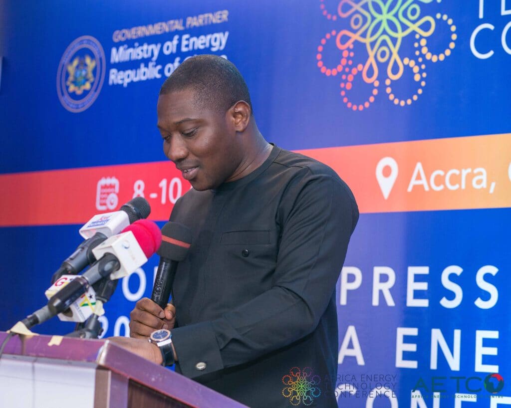 A speaker in a dark suit at the lectern at the press launch of the first Africa Energy Technology Conference, Alisa Hotel, Accra, June 2023