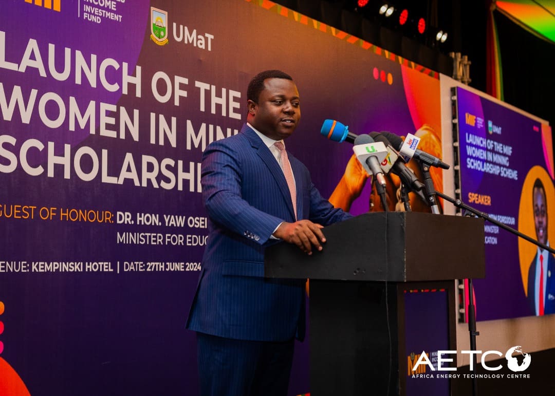 A speaker addresses guests beneath the Launch of the Women in Mining Scholarship banner