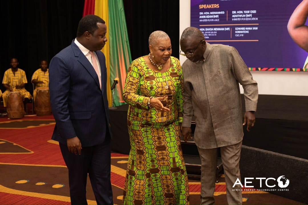 Guests stand together on stage at the launch of the Minerals Income Investment Fund's Women in Mining scholarship scheme, 2024