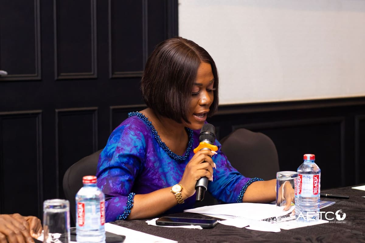 A guest speaks into a microphone from her table at the Centre's breakfast meeting for AETC 2025, Labadi Beach Hotel, Accra, November 2024