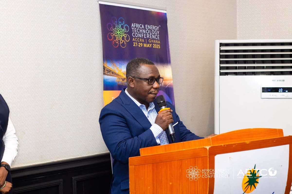 A speaker in a dark suit at the lectern at the Centre's breakfast meeting for AETC 2025, Labadi Beach Hotel, Accra, November 2024