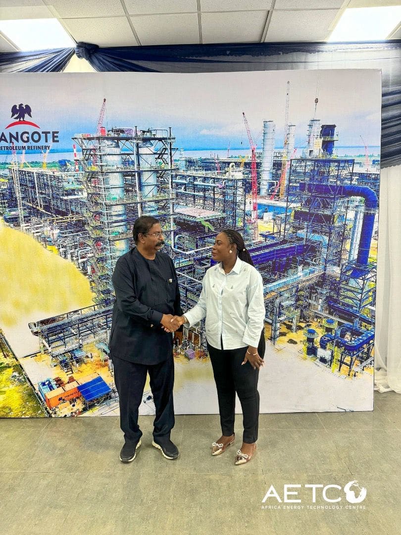 Visitors talk in front of the refinery's towers on a visit to the Dangote Petroleum Refinery, Lagos, 2024