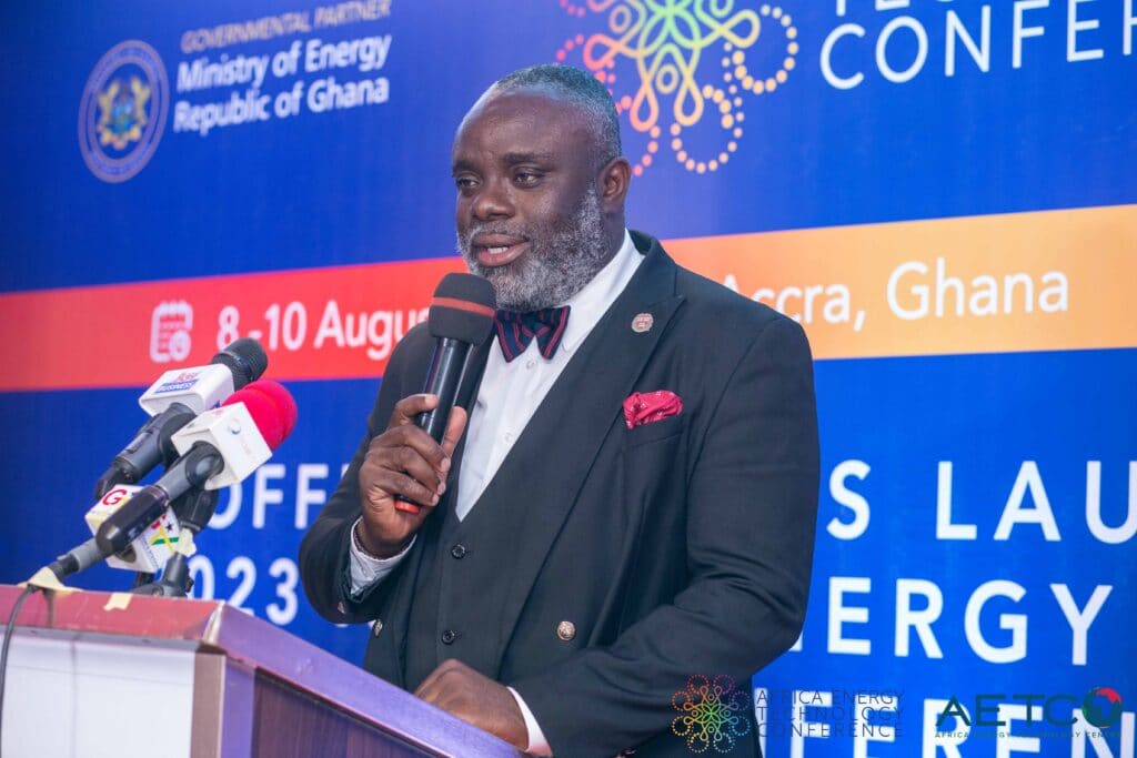 A speaker with a grey beard at the lectern at the press launch of the first Africa Energy Technology Conference, Alisa Hotel, Accra, June 2023