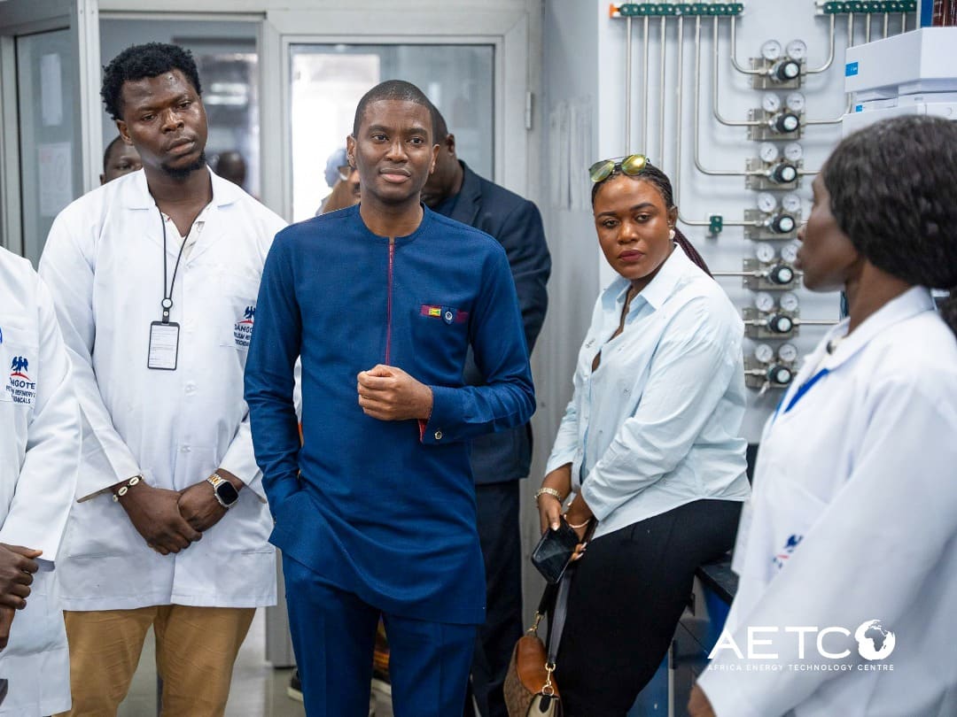Visitors in a laboratory, talking with staff on a visit to the Dangote Petroleum Refinery, Lagos, 2024